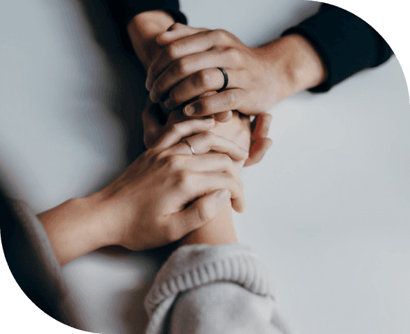 Hands holding in support – Life coach for lasting habits offering encouragement, accountability, and human connection.